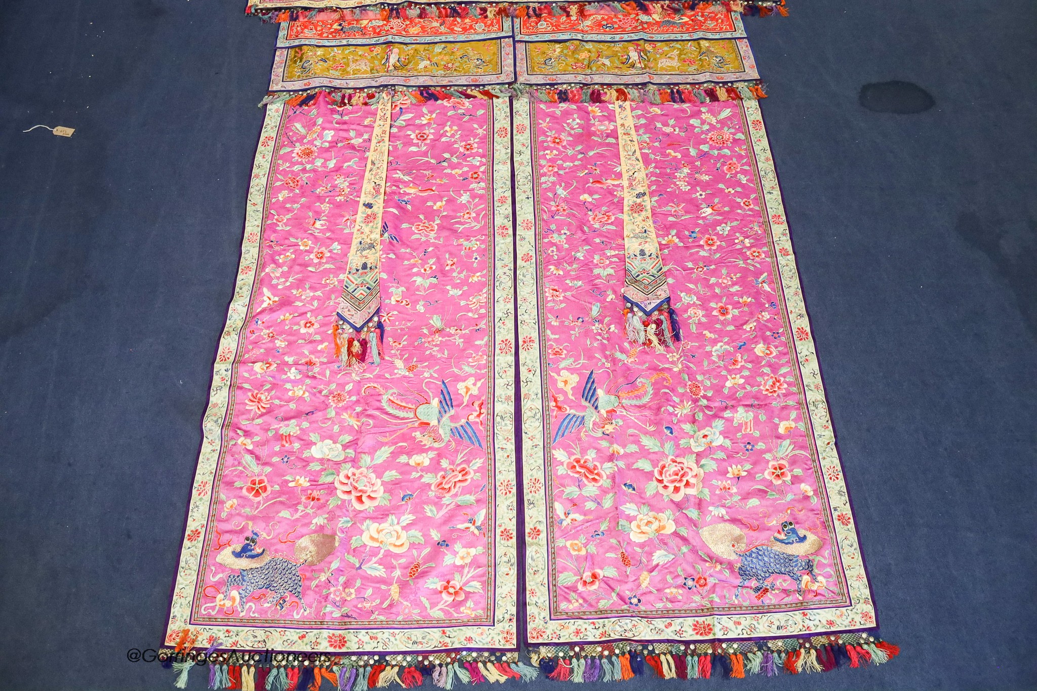 A pair of 20th century Chinese silk embroidered ceremonial panels, possibly for a wedding, 228cm not including fringing, each panel width 80cm, with a matching pelmet, width 198cm